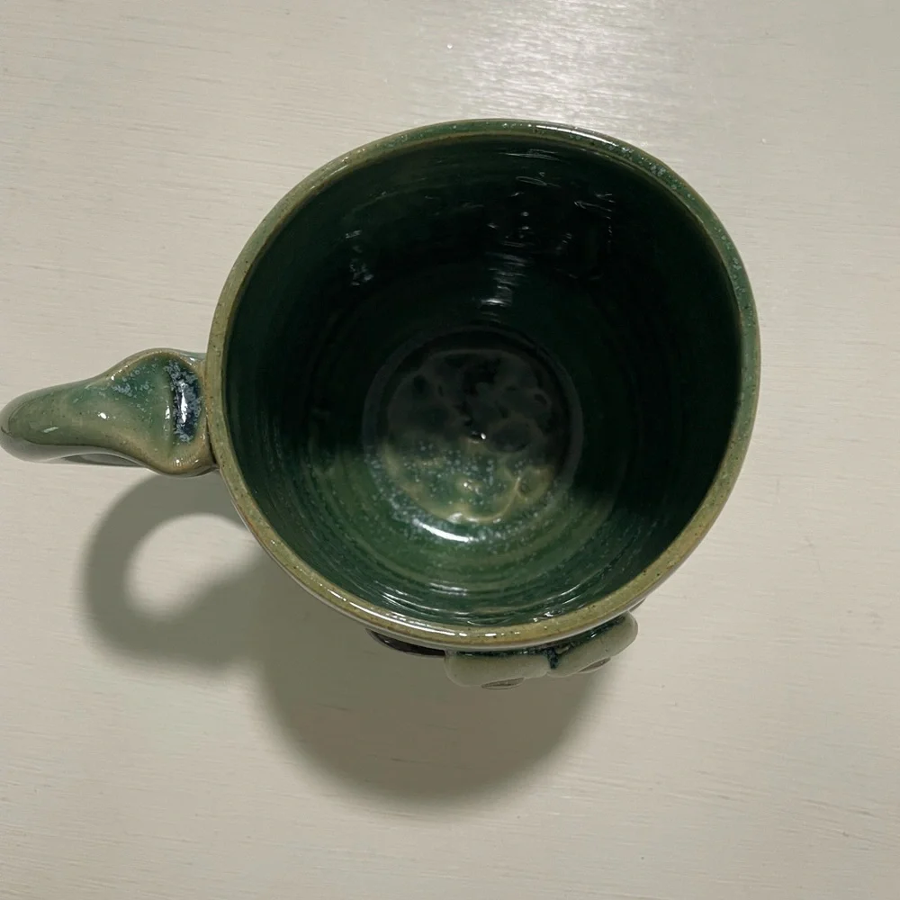 Good earth garden center mug with crazy face